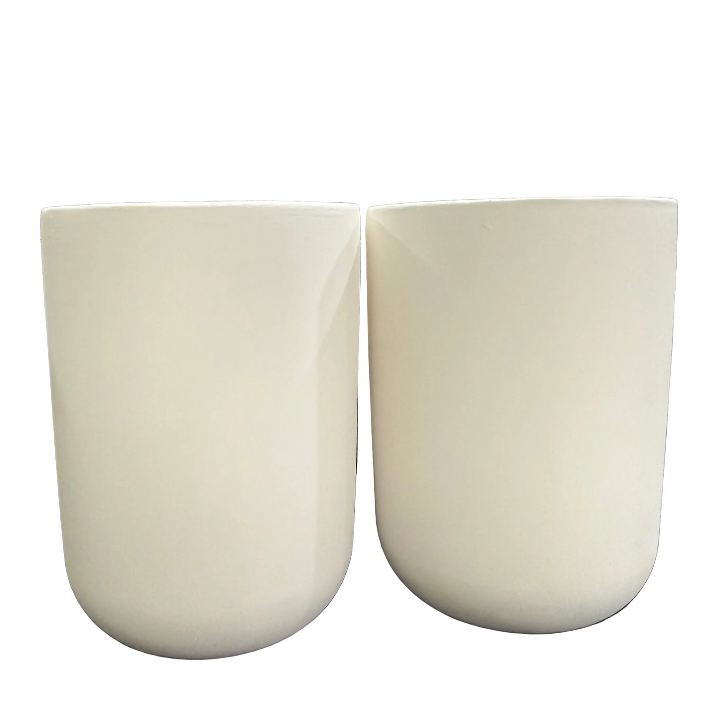 Two matte off-white ceramic cups  with a rounded bottom, shown side-by-side against a white background.